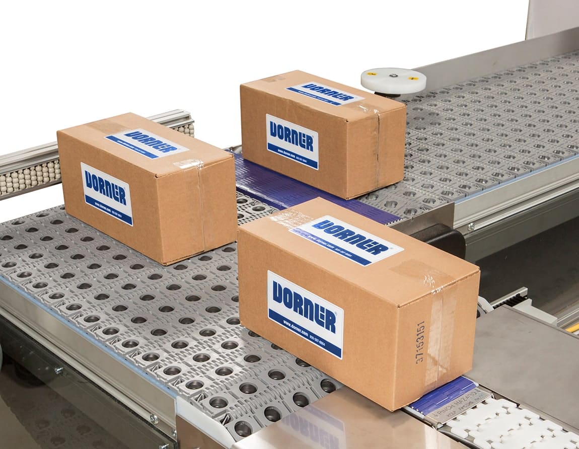 The corner of a rotating conveyor designed to seamlessly rotate products without disrupting the flow of production.