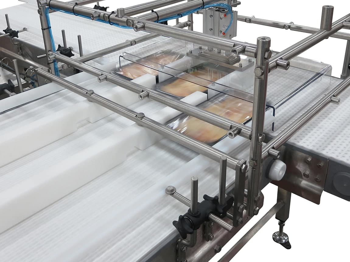 A three-lane conveyor designed for sanitary product rotation and movement.